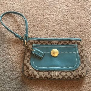 Authentic large coach wristlet with blue leather